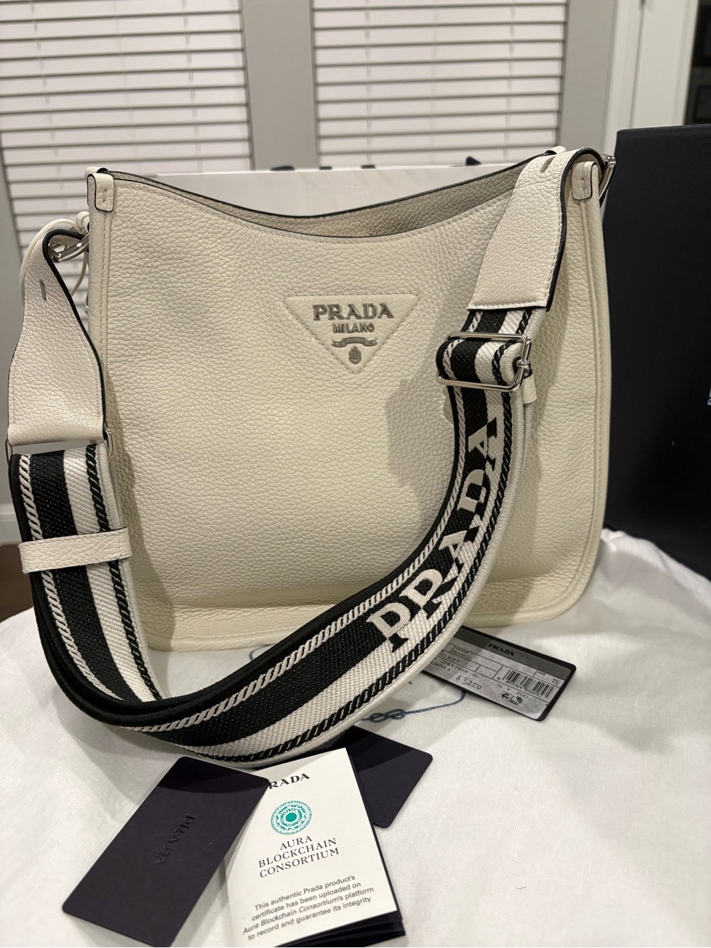 Prada Pebbled Leather Hobo with Black-and-White Logo Strap